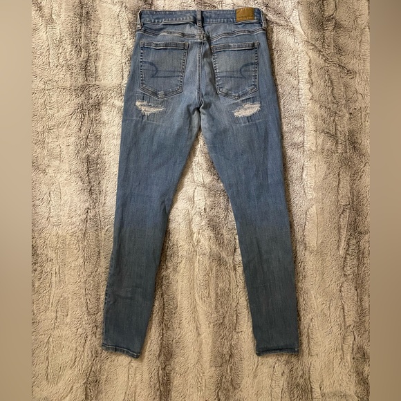 American Eagle | High Rise Super Stretch Skinny Distressed Light Blue Jeans - Picture 4 of 7